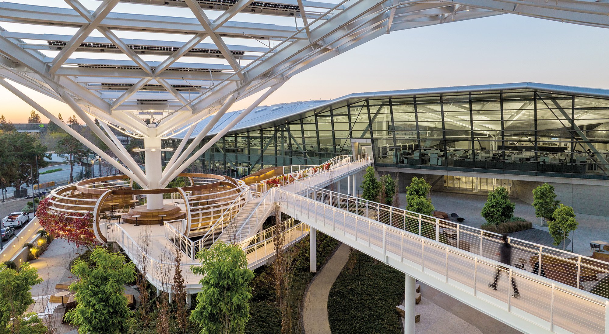 under the steel canopy of the Tree like structure inside the NVIDIA campus  with multiple stairs attached to move across the open space. 