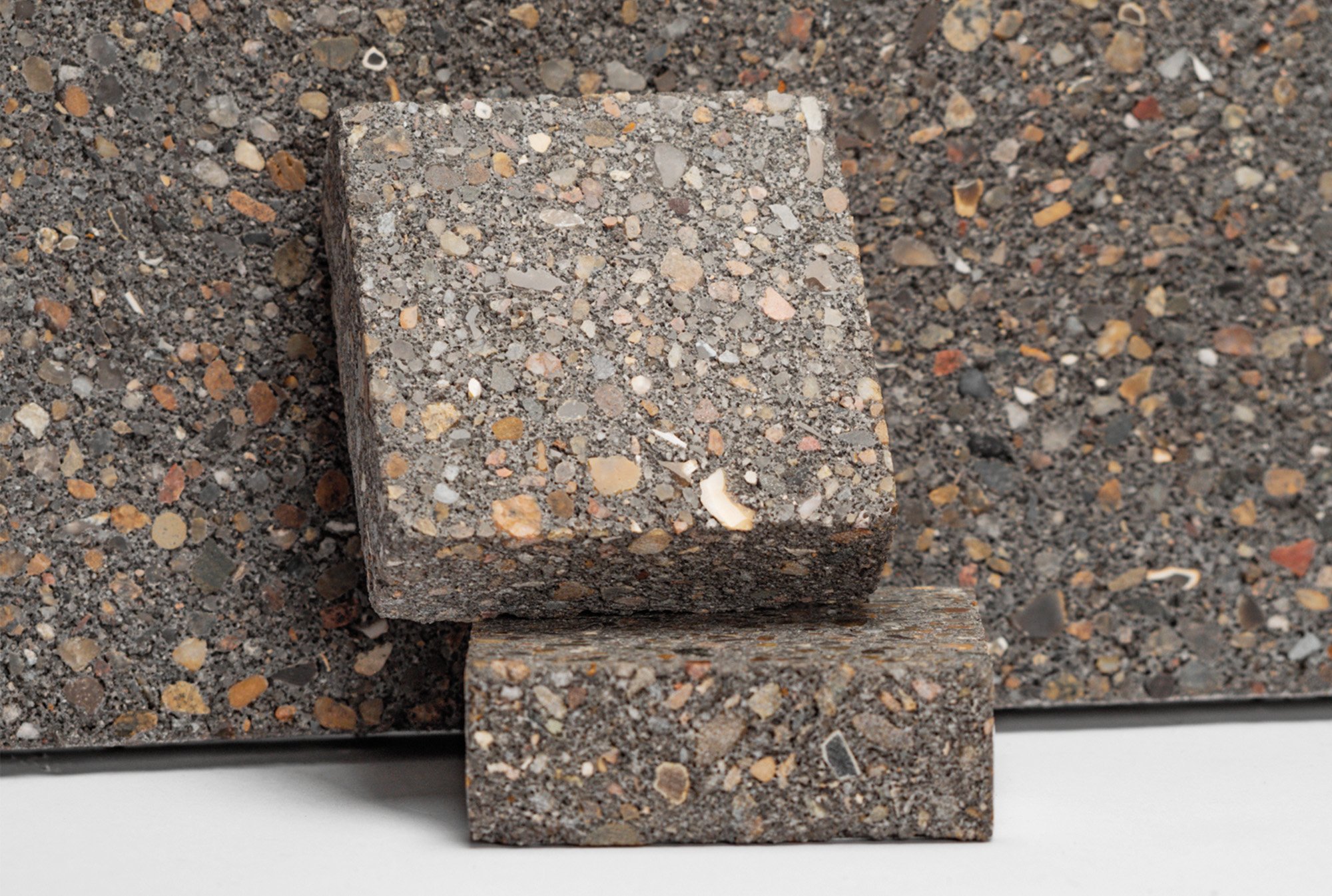 2 pieces of terrazzo look alike bio based brick kept against the same brick material. 