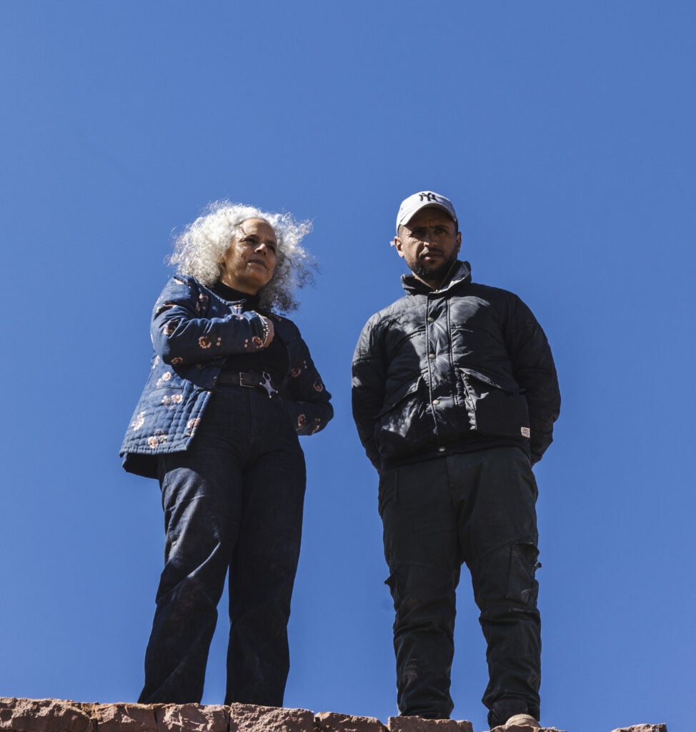 Salima Naji and a member of the construction team in Timinkar, in the Atlas Mountains of Morocco. Courtesy Salima Naji 