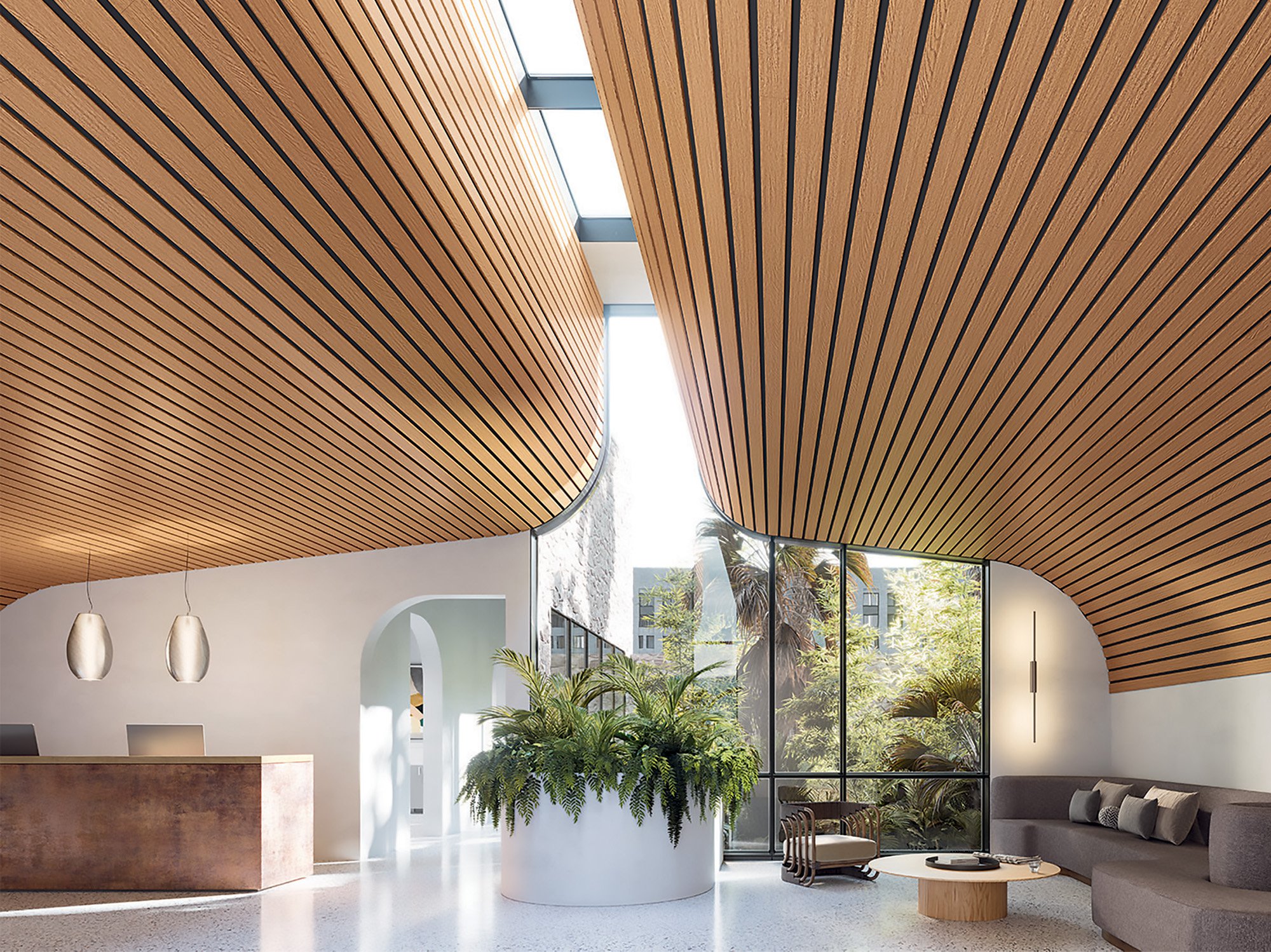 An opening inside an office space with wooden curved ceilings and a large planter centre piece along with lounge sofa furniture. 