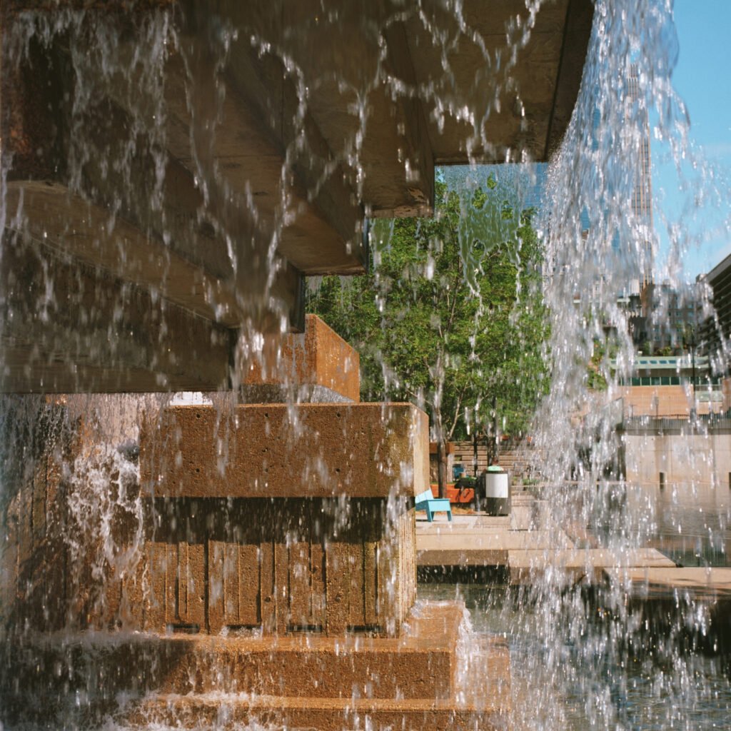 image of a concrete fountain with a close up detail of water falling